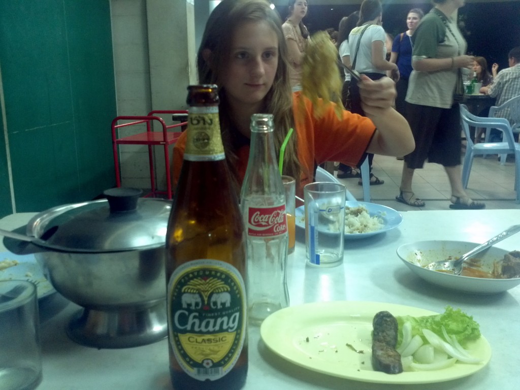 Eating traditional Northern Thai food with Chang beer and the weird sausage