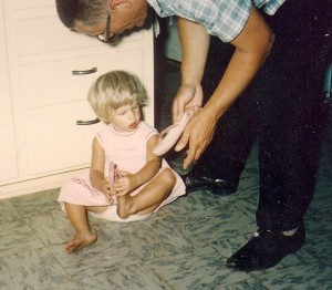 Helping me with my flipflops at age 2 1/2